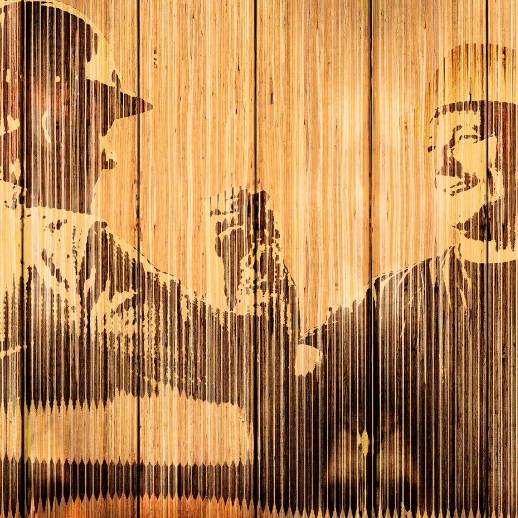 Two smiling workers gripping hands, in a display of strength, satisfaction, and camaraderie